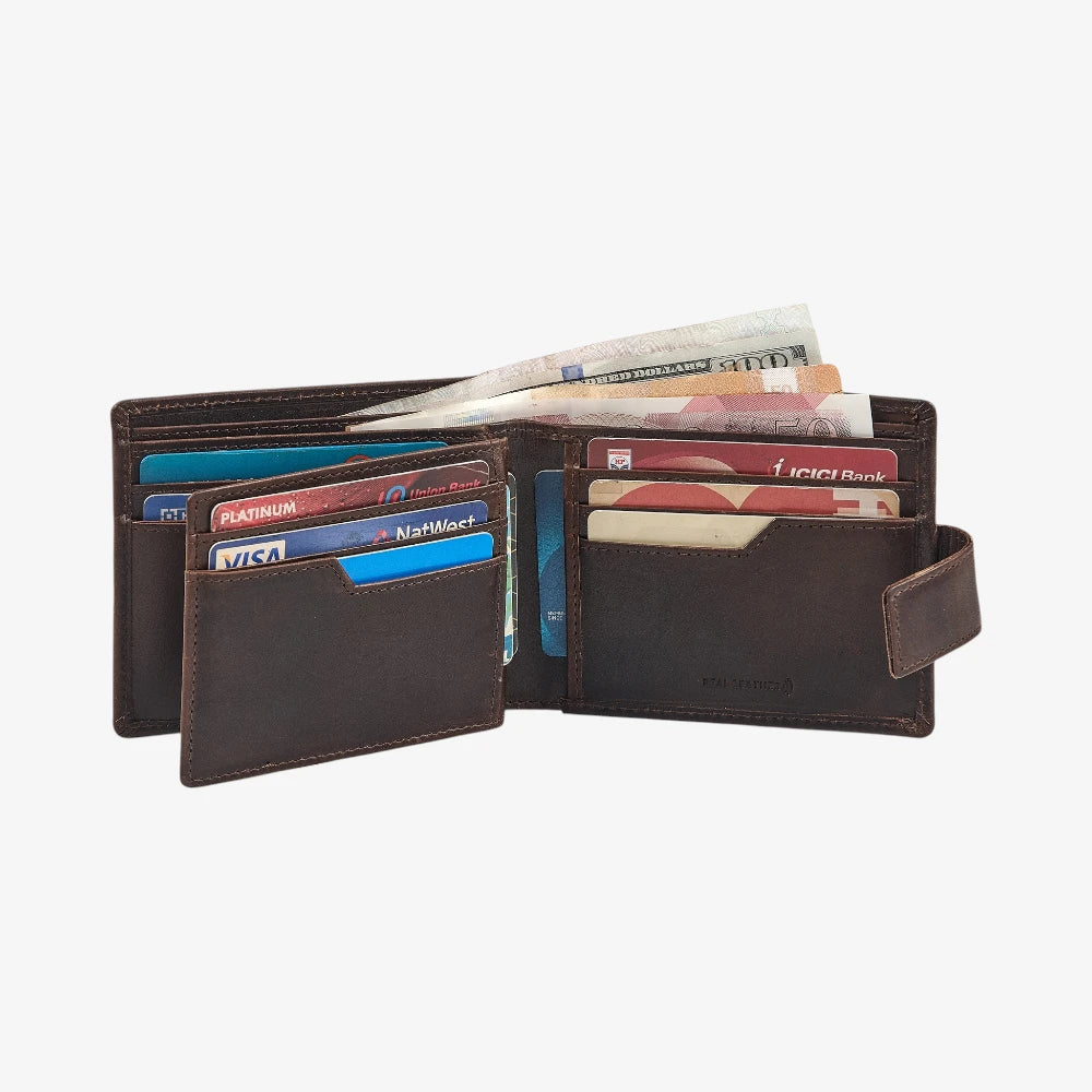 Brown leather wallet with various cards and money on a white background