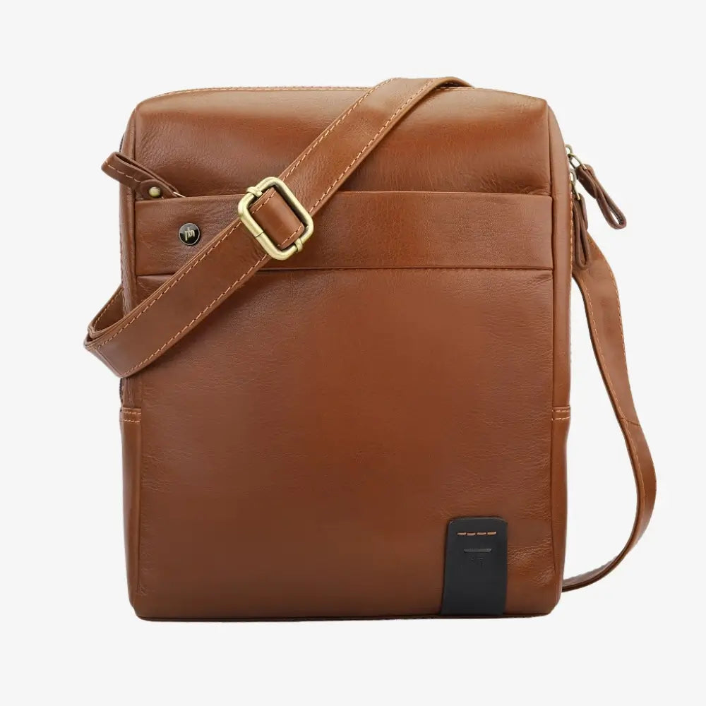 Tan leather messenger bag with a gold buckle on a white background