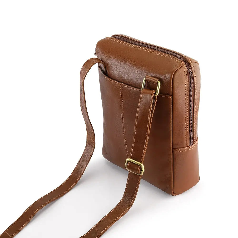 Tan leather messenger bag on a white background