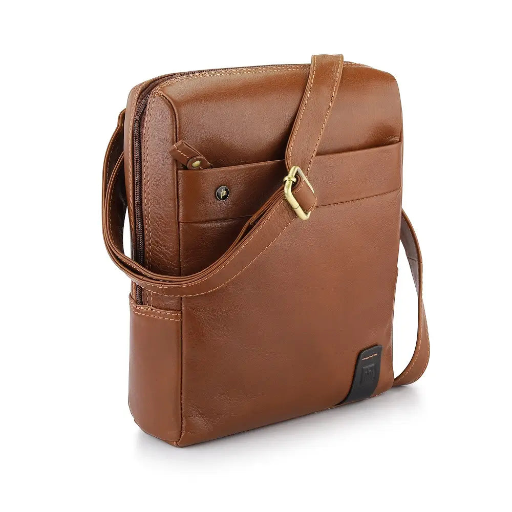 Tan leather messenger  bag on a white background