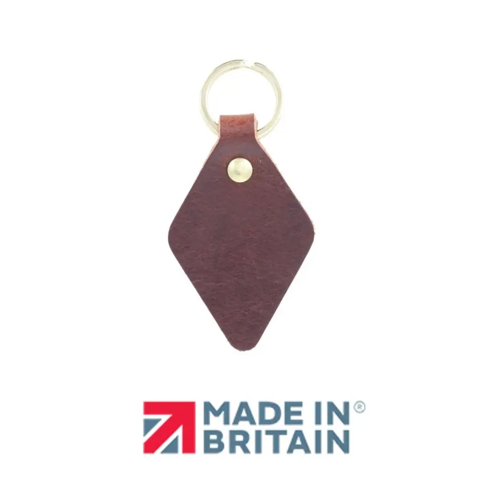 Chocolate leather keychain with gold accent on a white background, featuring 'Made in Britain' logo.