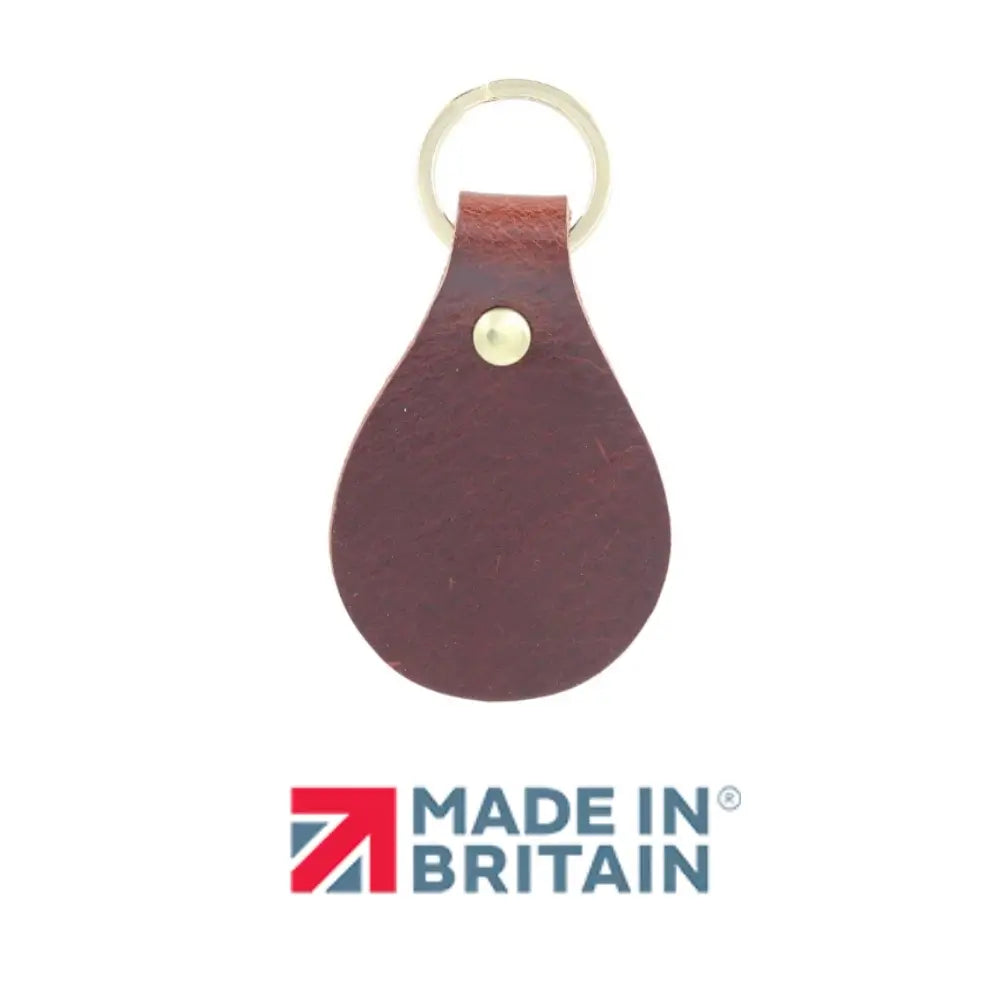 Chocolate leather keychain with a gold ring on a white background, featuring 'Made in Britain' logo.