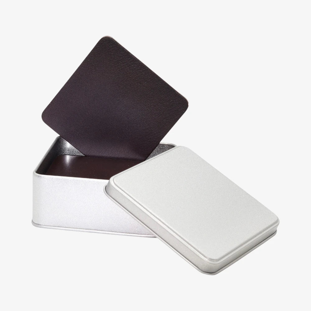Chocolate Full grain leather coasters with natural grain on a white background