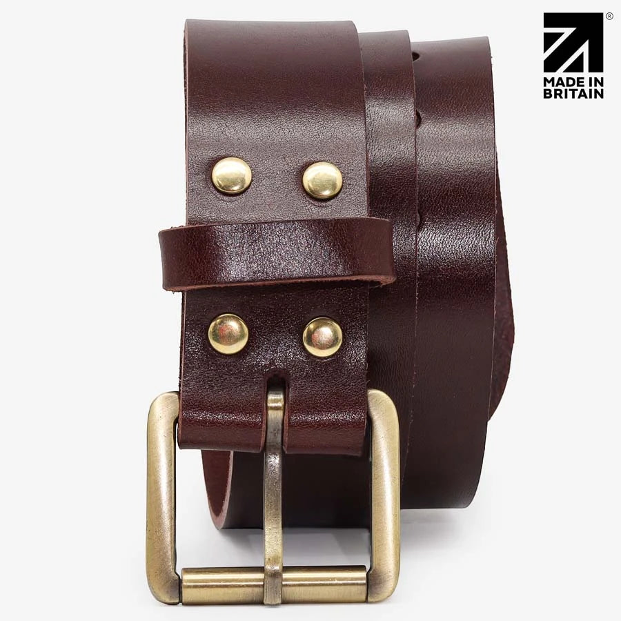 Front view of the solid brass roller buckle on a brown leather belt