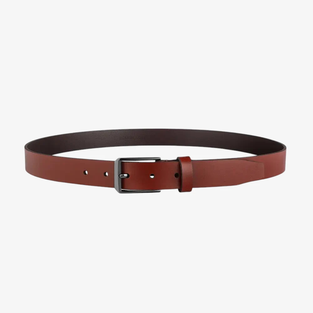 Full length view of  leather belt with a silver buckle on a white background