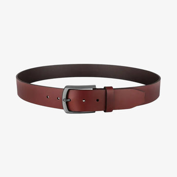 Full length view of Cognac leather belt with a silver buckle on a white background