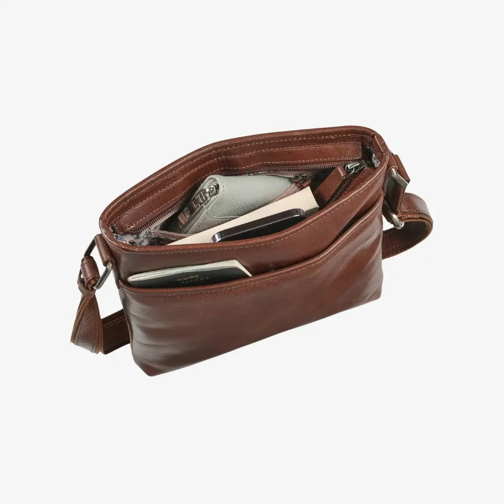 Cognac leather crossbody bag with compartments on a white background