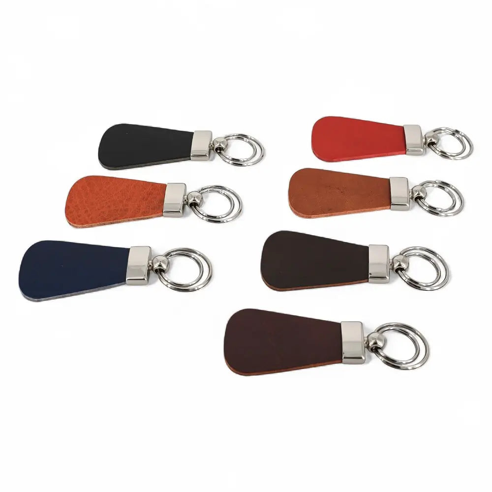 Set of leather keychains with metal rings on a white background