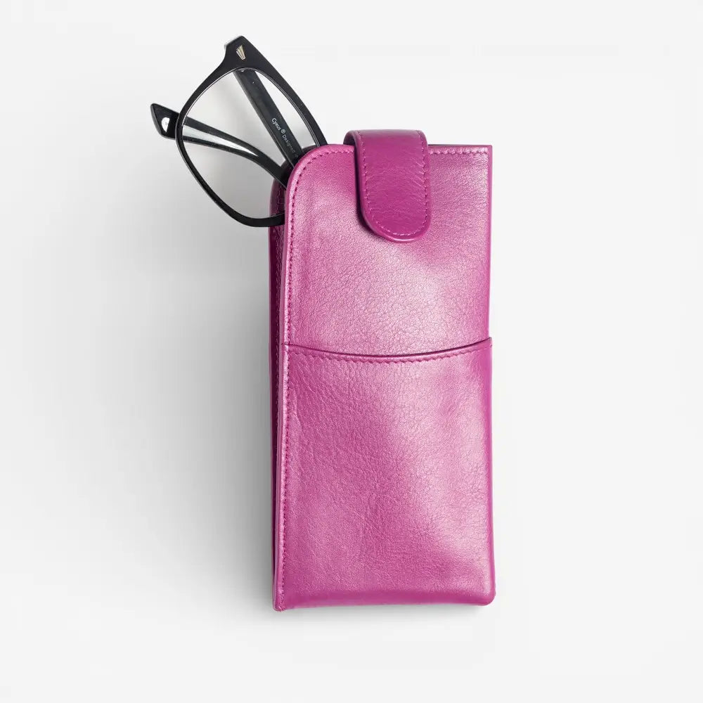 Fuchsia glasses case with a pair of glasses on a light gray background