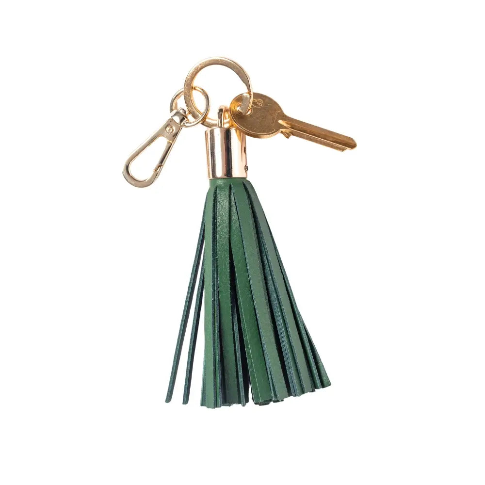 Green tassel keychain with a gold key on a white background