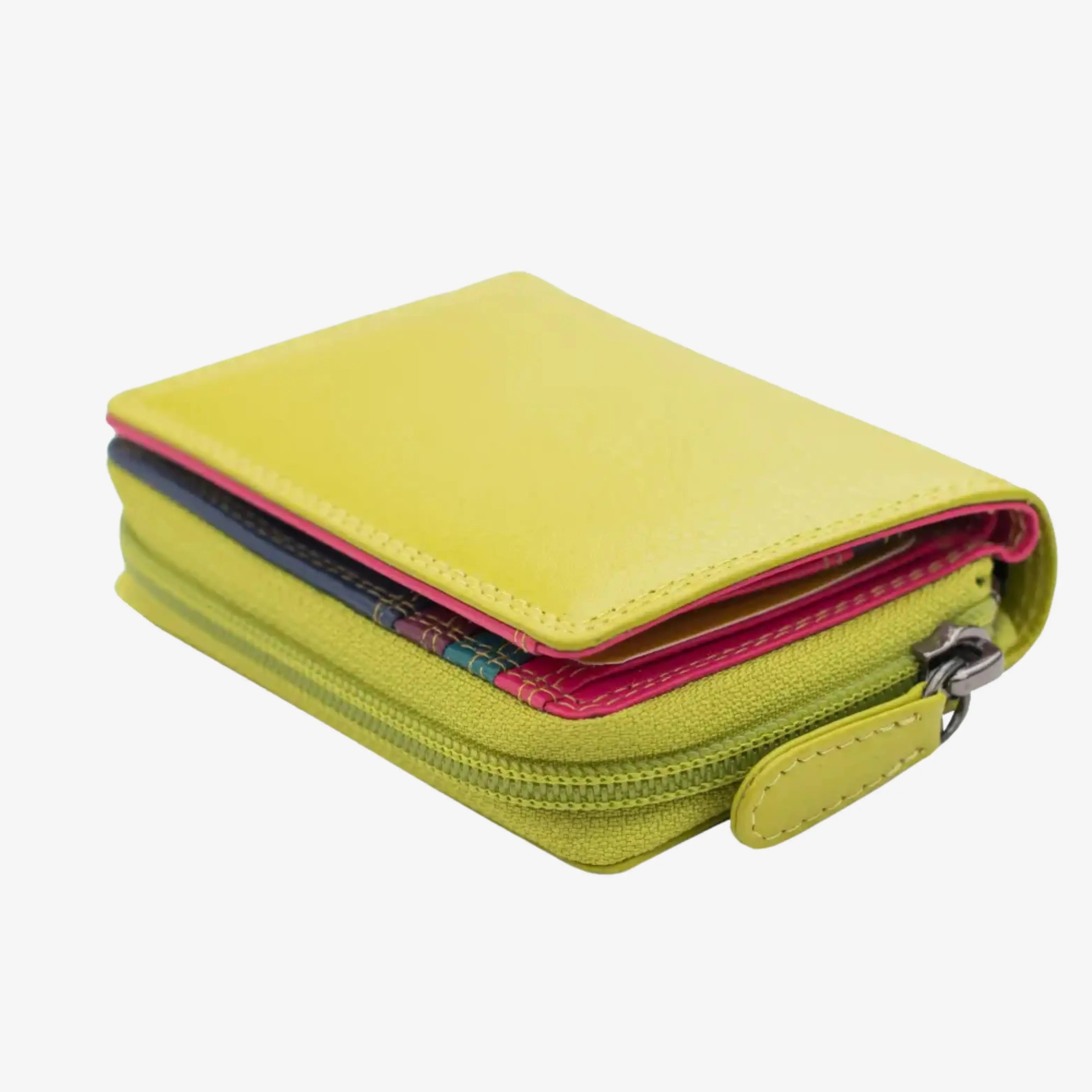A green zip-around wallet with a bright yellow cover flap, pink interior lining, and a dark blue patterned card slot, shown on a light gray background.
