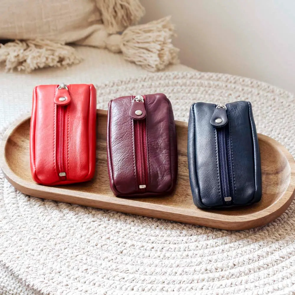 Group shot of  Small Leather Zipper Keyring Pouch on grey background