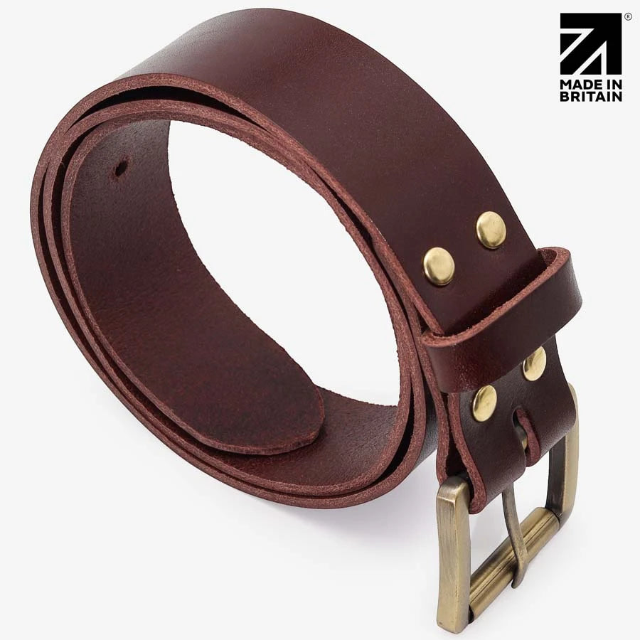 Coiled brown leather belt showing the gloss finish and brass roller buckle