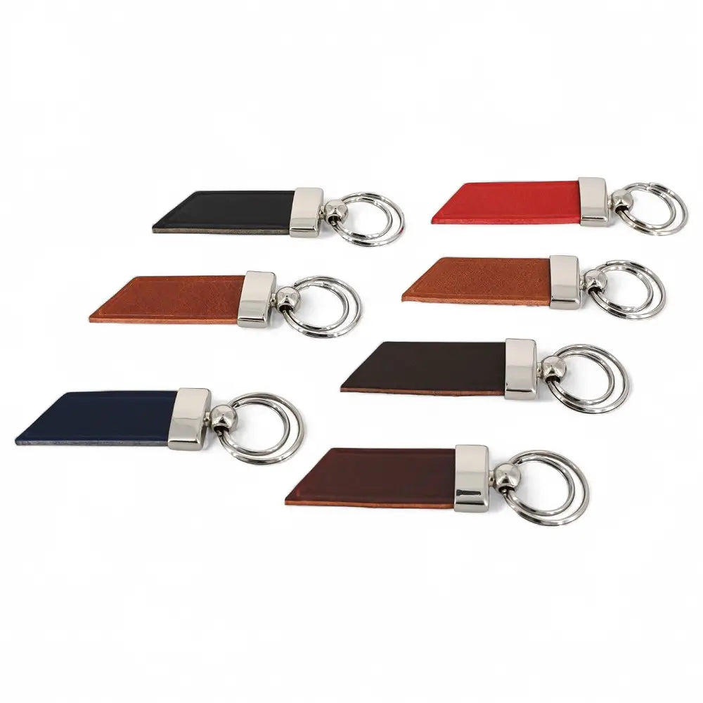 Set of leather keychains with metal loops on a white background