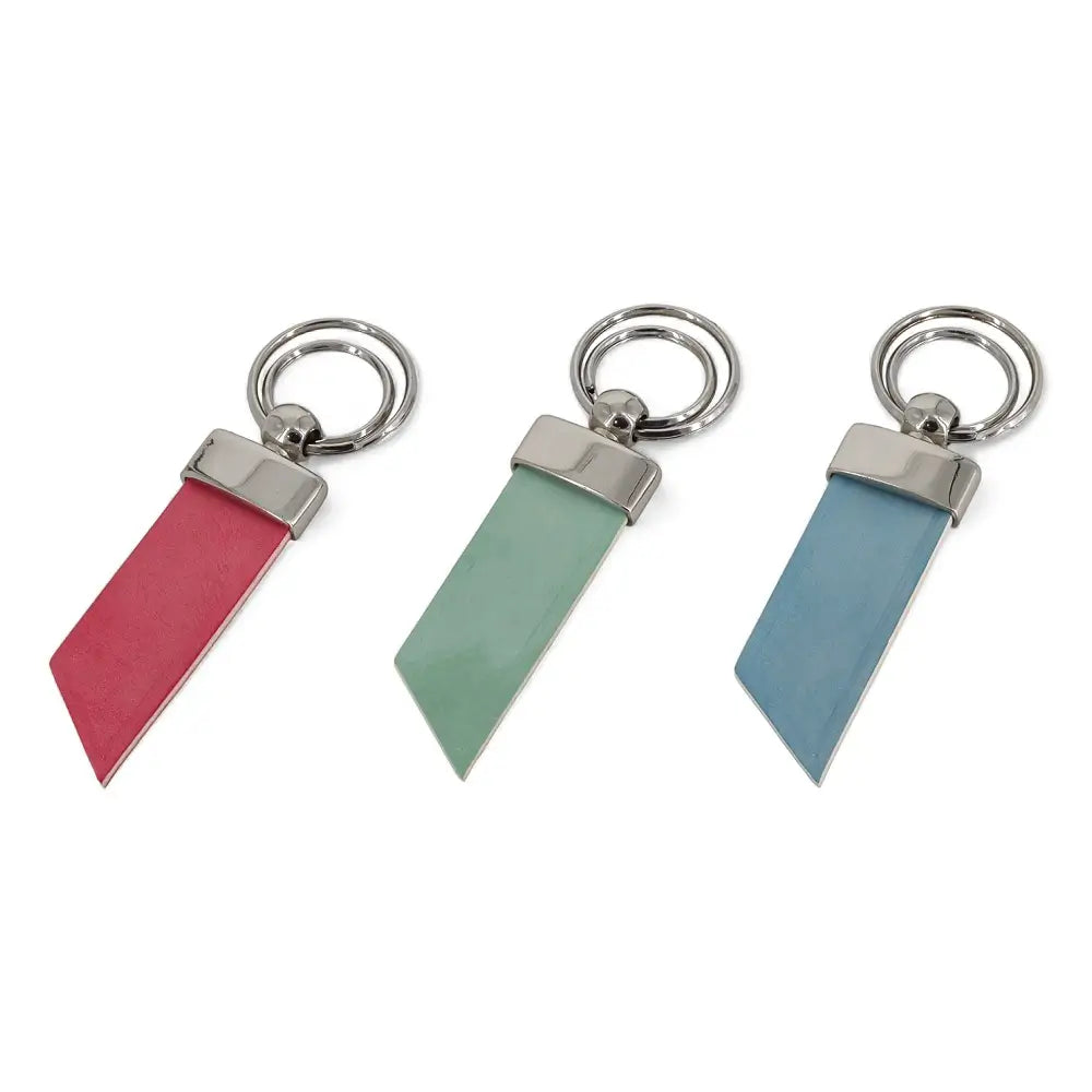 Three keychains with different colored leather strips on a white background