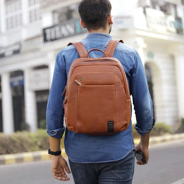 Person wearing Tan leather backpack Morgan Tuscan Bag