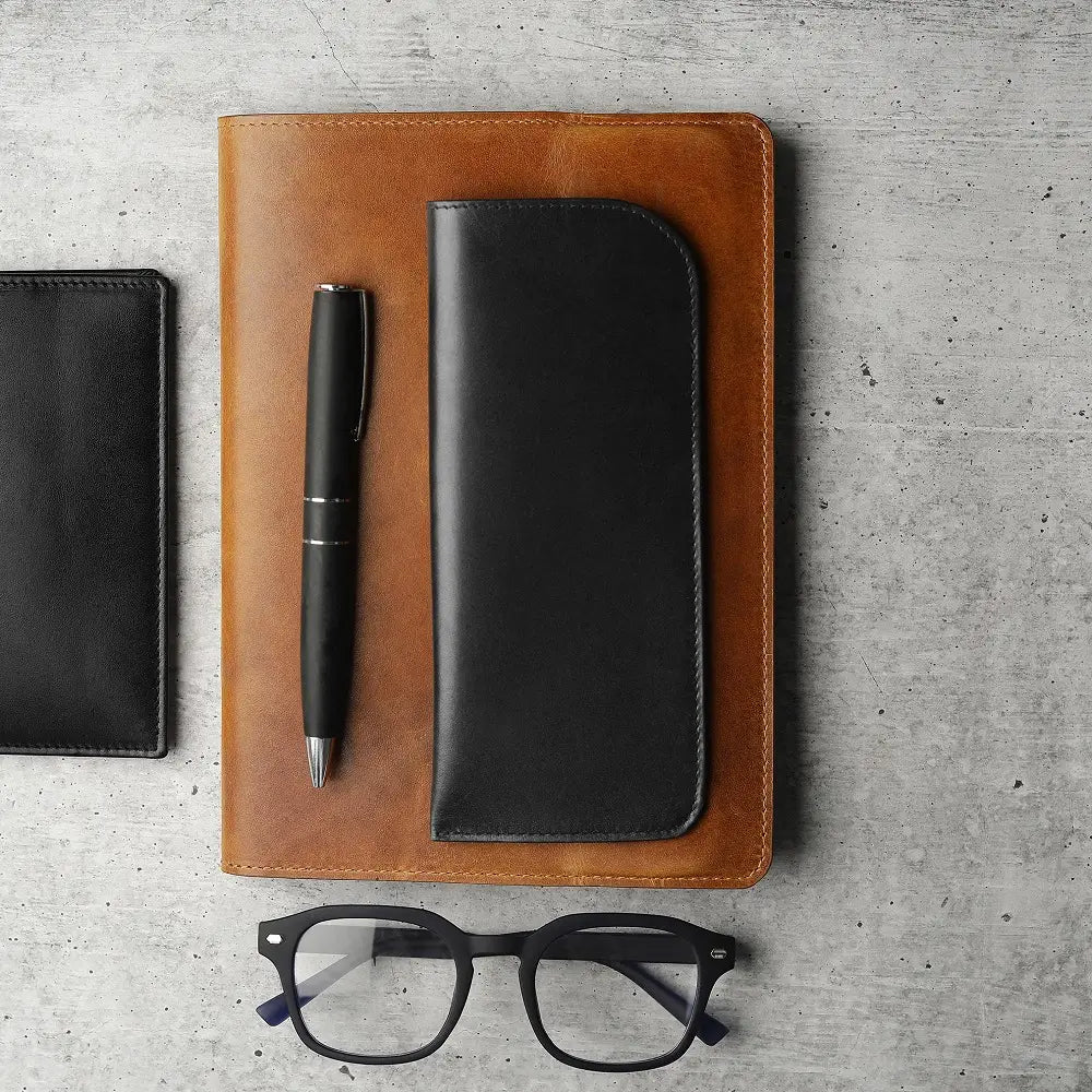 Black leather lined glasses pouch on a white background
