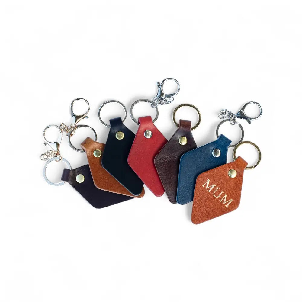 Set of leather keychains in various colors  on a white background