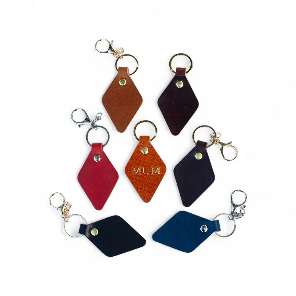 Set of colorful leather keychains on a white background