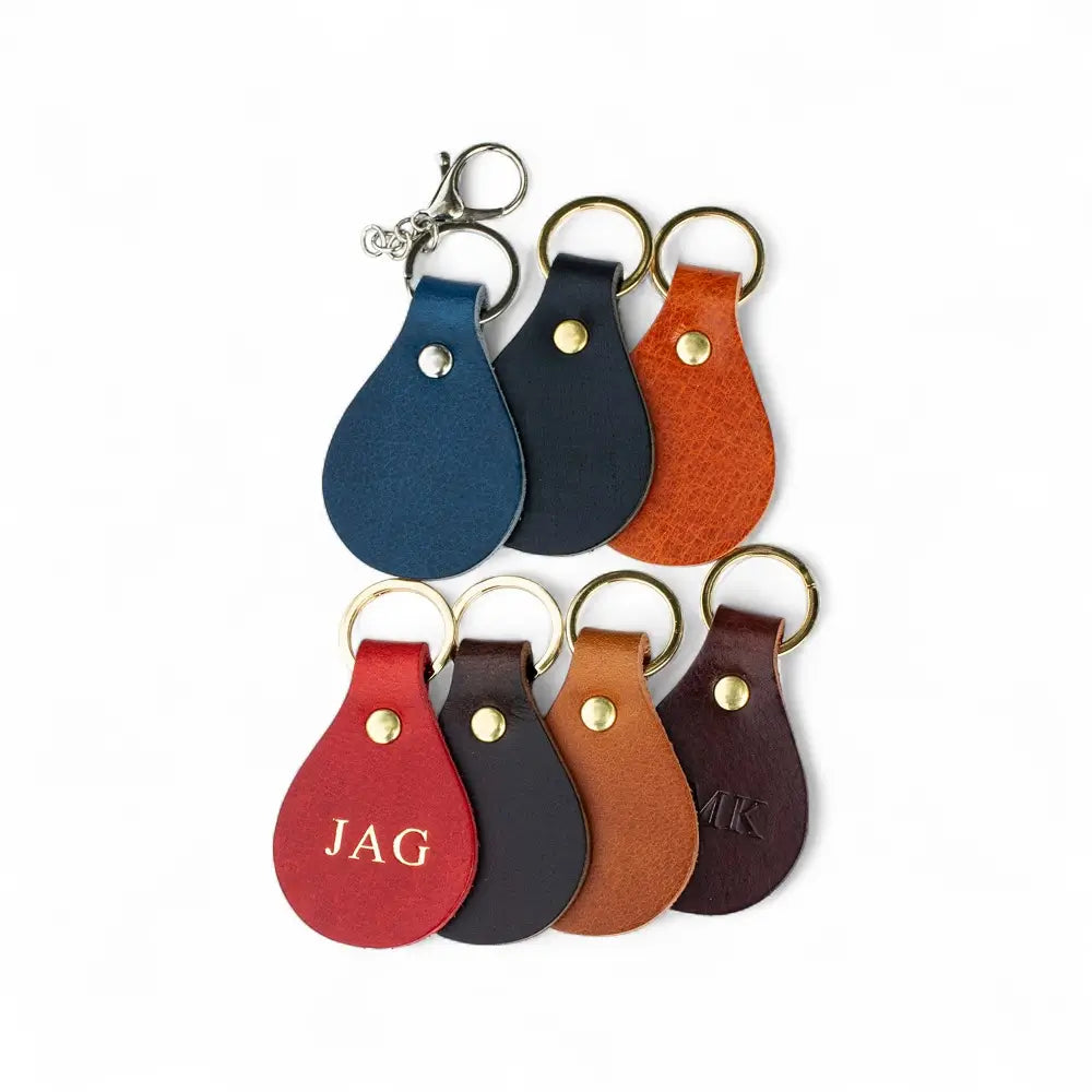 Set of leather keychains in various colors on a white background