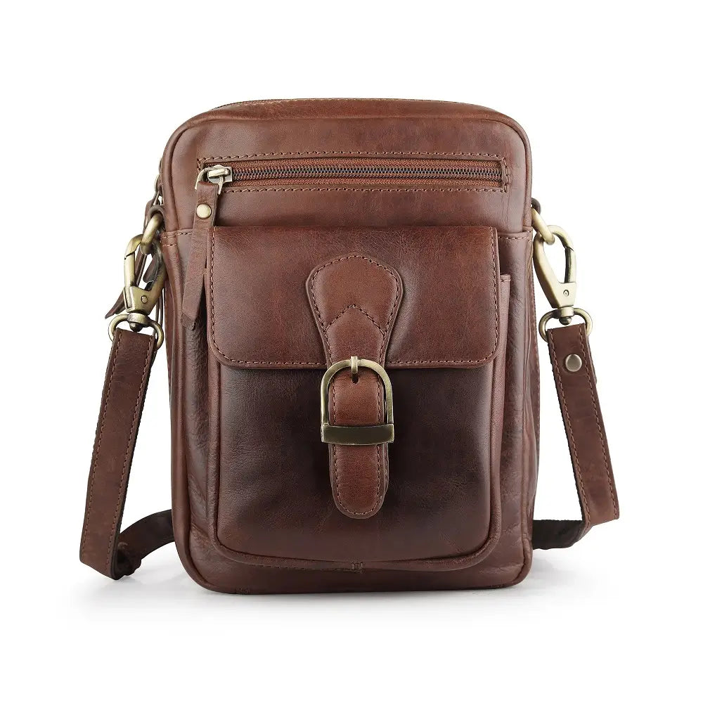 Front view of brown leather crossbody messenger bag with buckle-style flap pocket and zip compartment