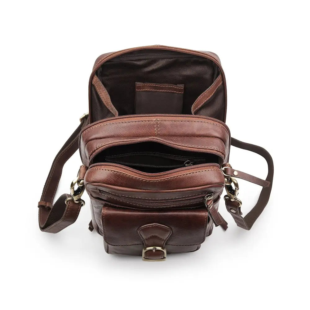 Open view of brown leather crossbody messenger bag revealing spacious main compartment with fabric lining