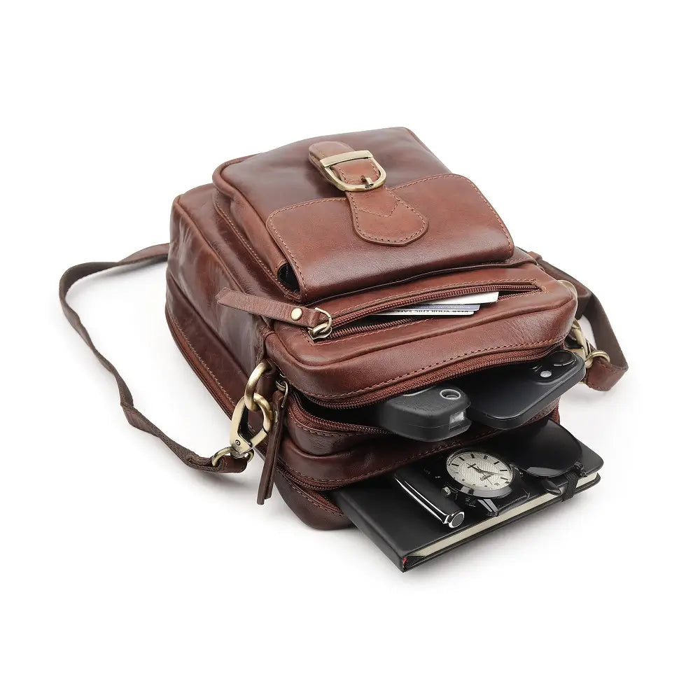 Brown leather crossbody bag displaying organised storage with room for wallet, phone and daily essentials