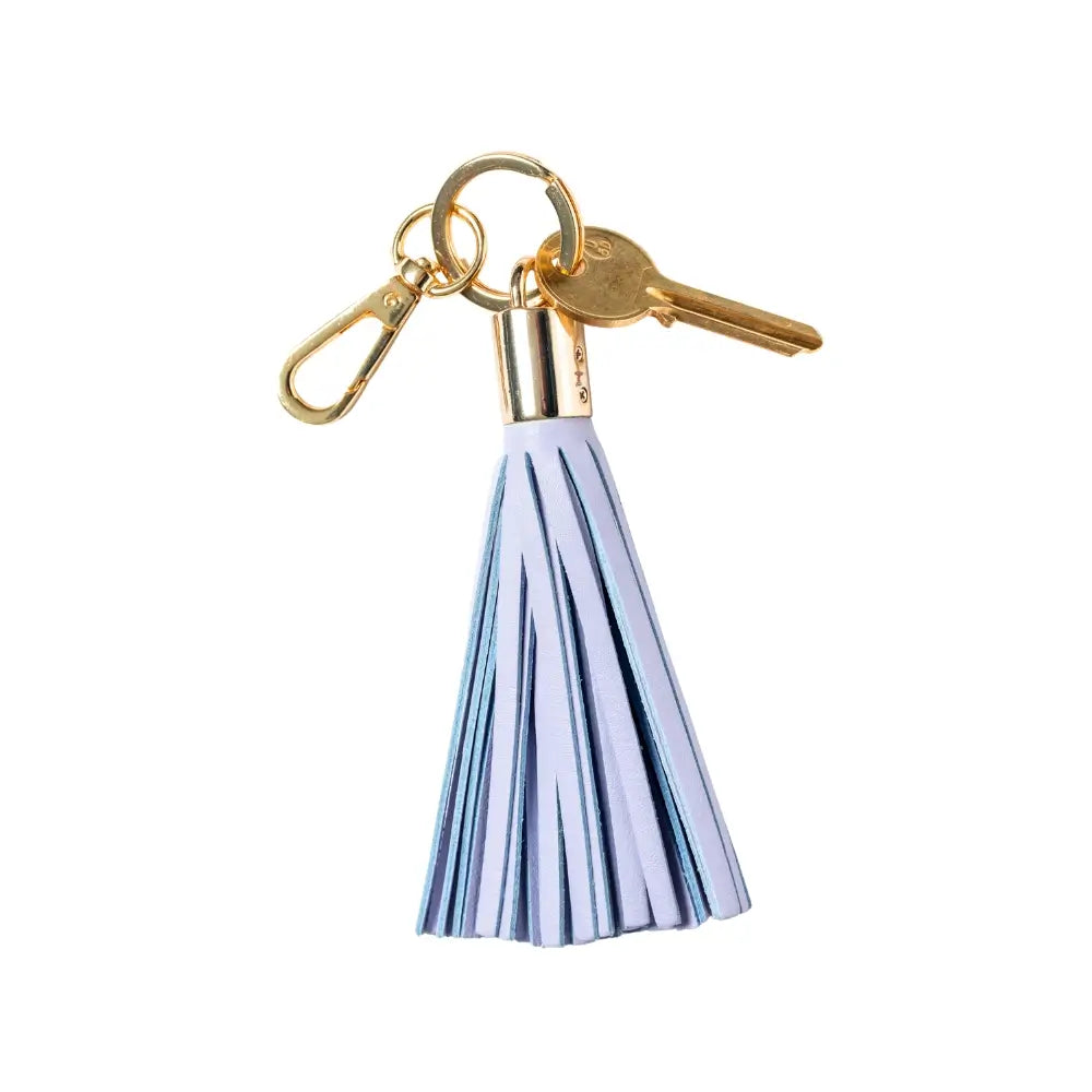 Keychain with Lilac tassel and gold accents on a white background