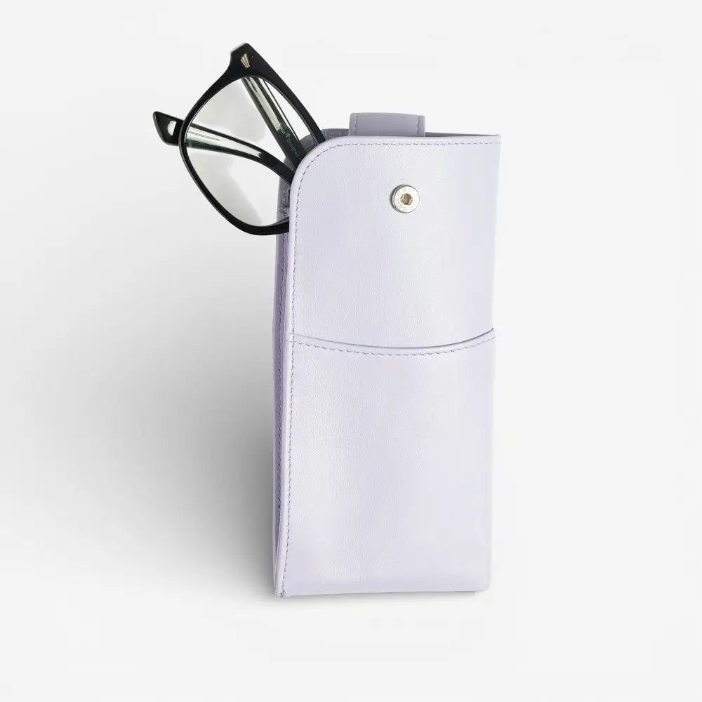 Lilac glasses pouch with black-framed glasses on a light gray background