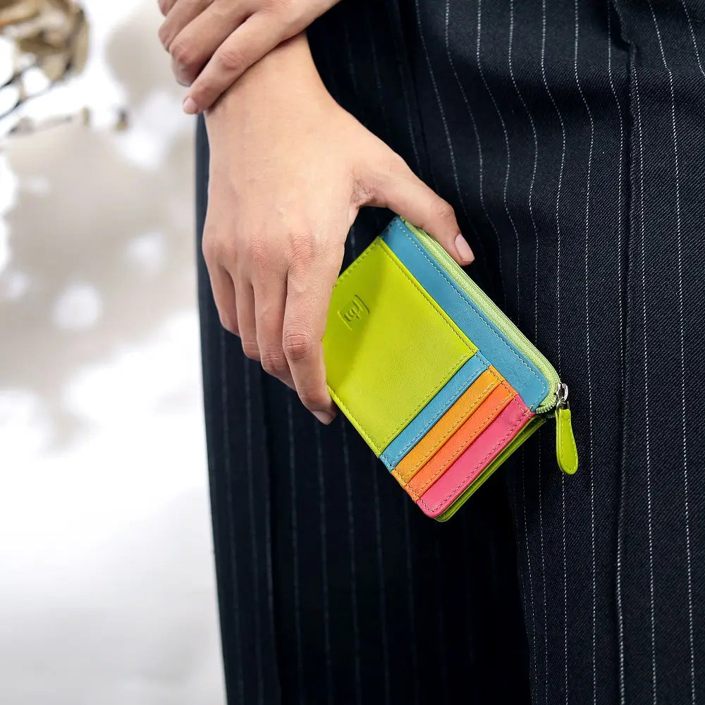 Lime Card Holder Purse held by a person wearing a dark pinstripe suit.