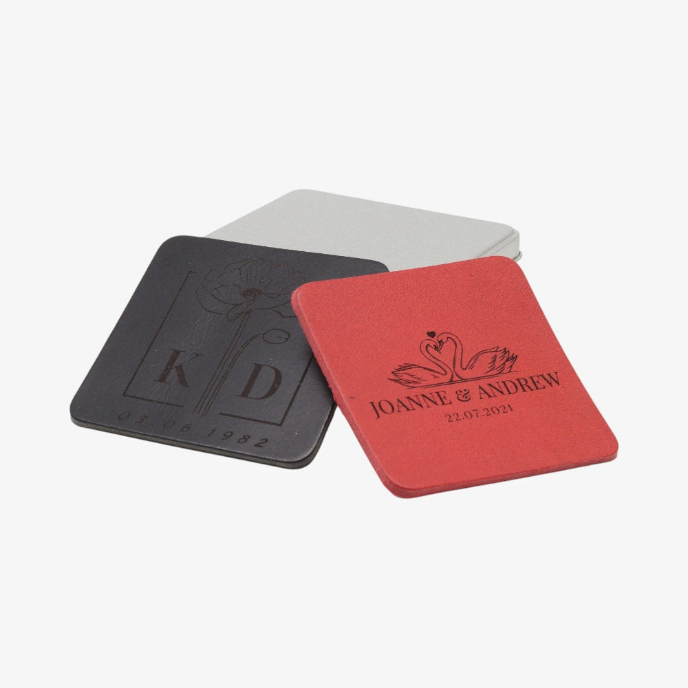 Two coasters, one black and one red, with personalized designs on a white background.