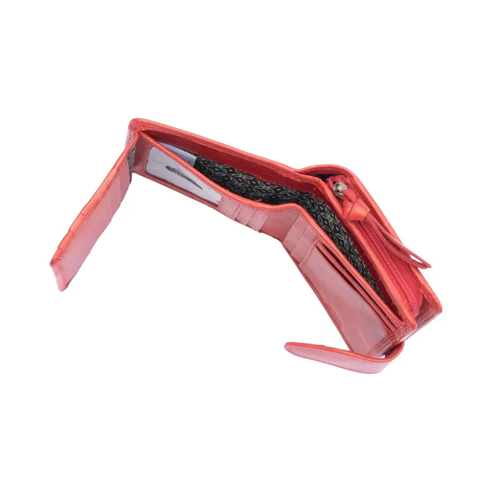 Side profile of Red Paloma trifold purse showing compact design