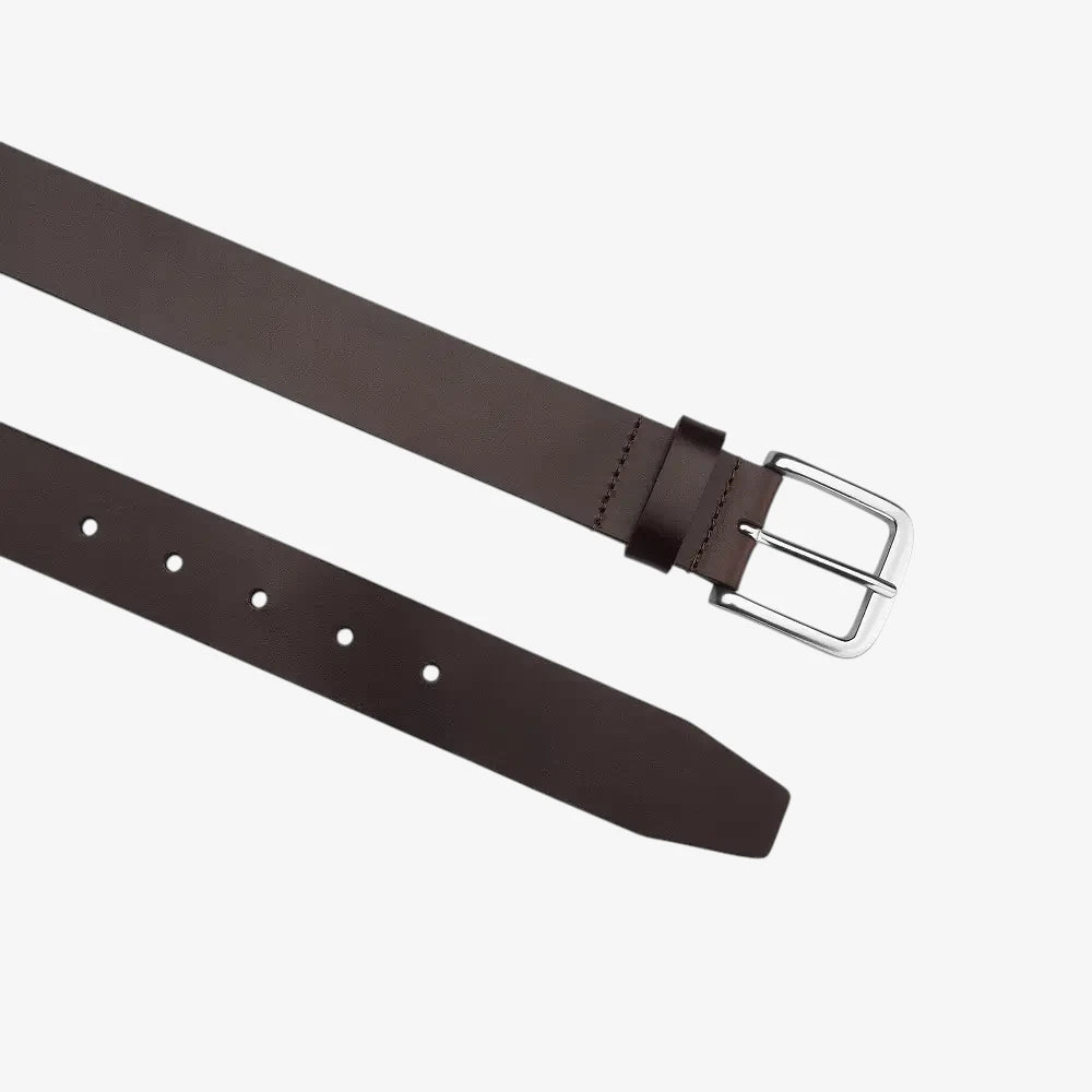 Top angle view of Brown leather belt with a silver buckle on a white background