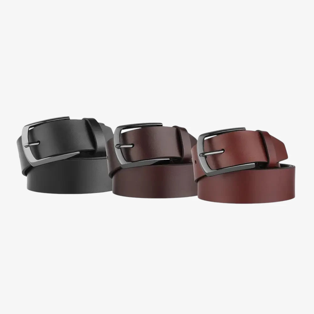 Three belts in black, brown, and cognac with silver buckles on a light gray background
