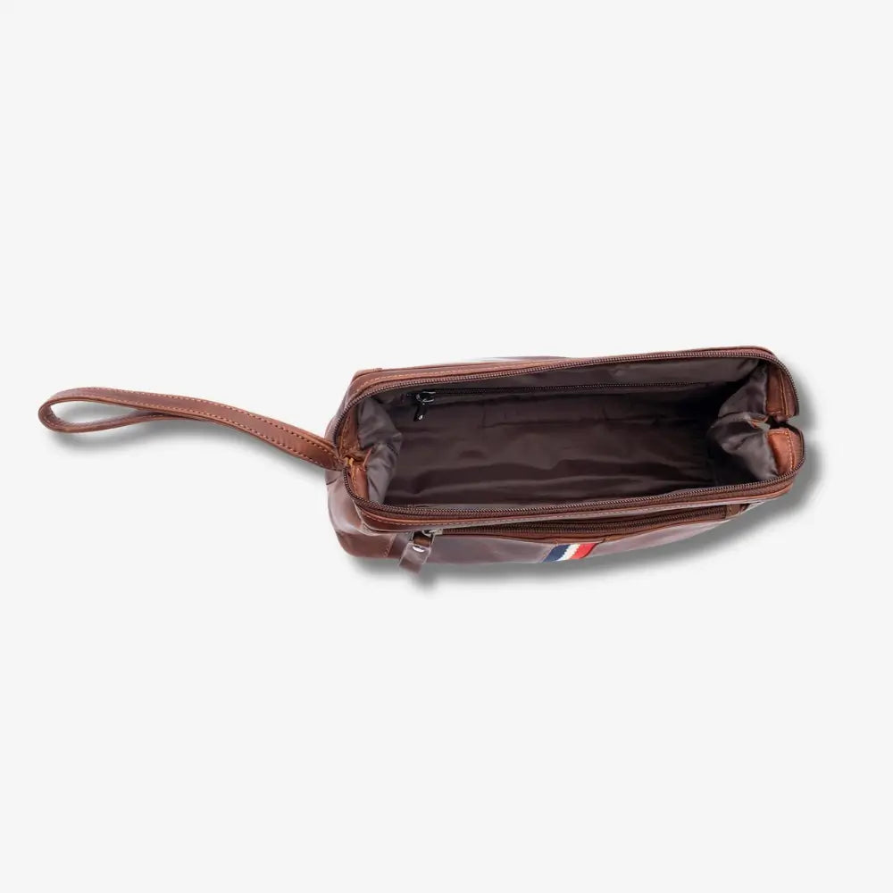 A tan leather zippered pouch with a wrist strap, shown from a top-down view with its interior open, on a light gray background.