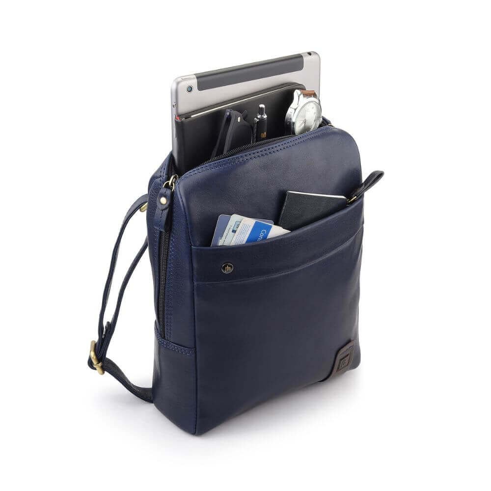 Side-angled view of navy real leather messenger bag with gold-tone hardware – smart and compact crossbody design for work or daily carry.