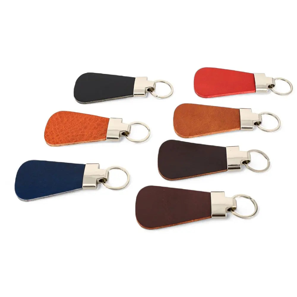 Set of leather keychains in various colors on a white background