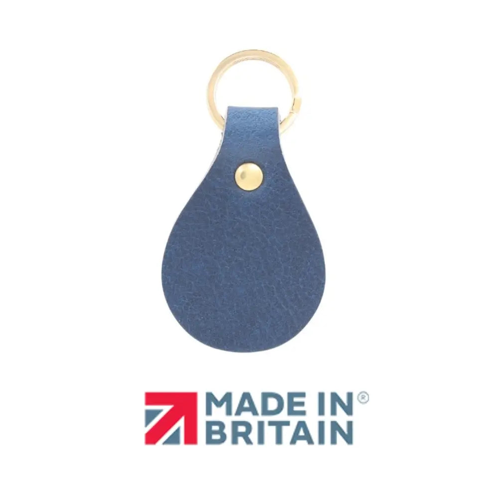 Navy leather keychain with a gold ring on a white background, featuring 'Made in Britain' logo.