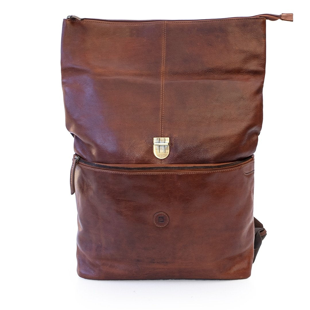 a brown leather backpack is open to show the roll top design