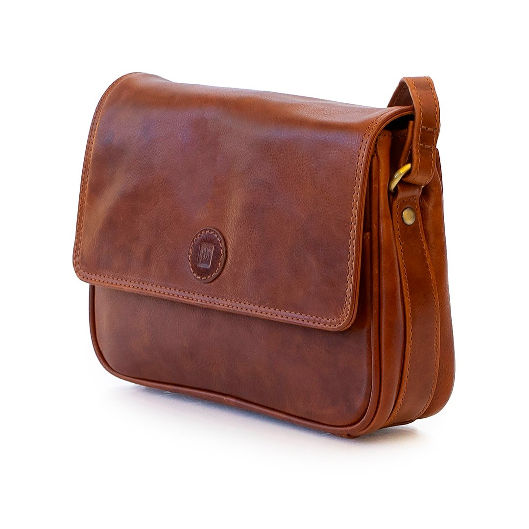 brown leather bag, closed up view to show detailed stitching and buttery soft leather.