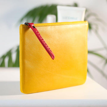 Slim soft yellow leather makeup pouch – side profile