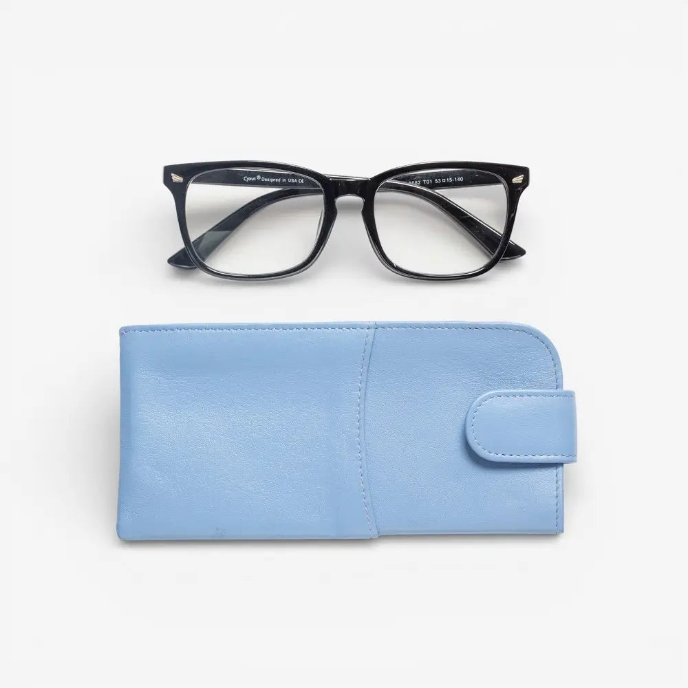 Black glasses on a pastel blue case against a white background