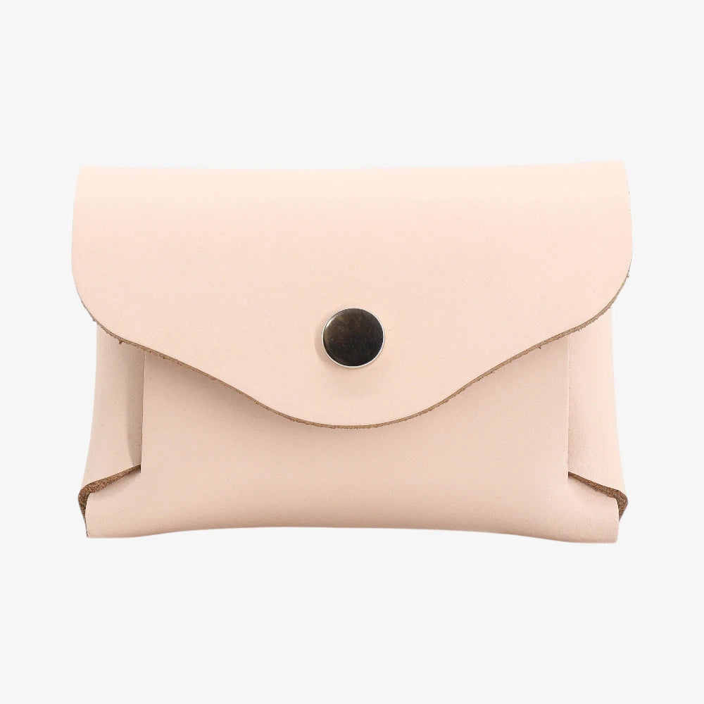 Peach leather coin purse with textured finish and snap button flap closure