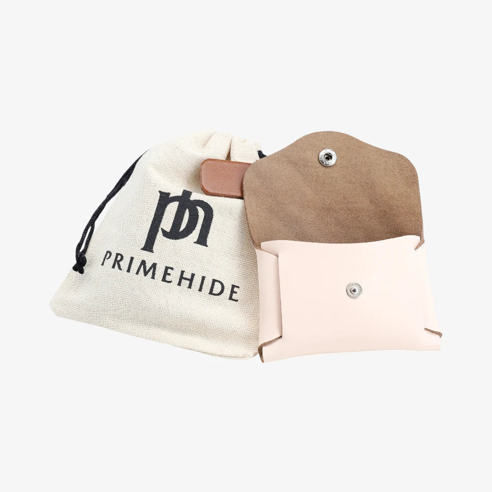 Peach leather coin purse open view with Primehide branded drawstring pouch
