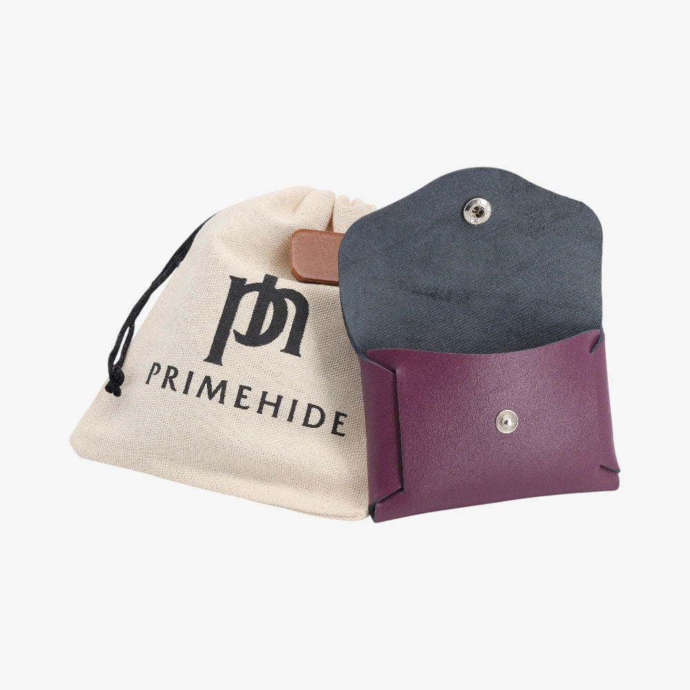 Plum leather coin purse open view with Primehide branded drawstring pouch