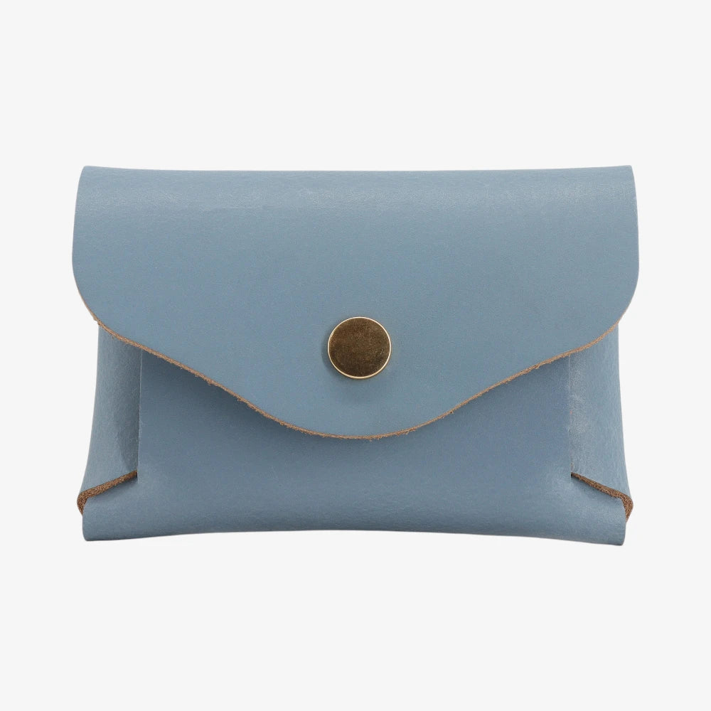 Powder blue leather coin purse with textured finish and snap button flap closure