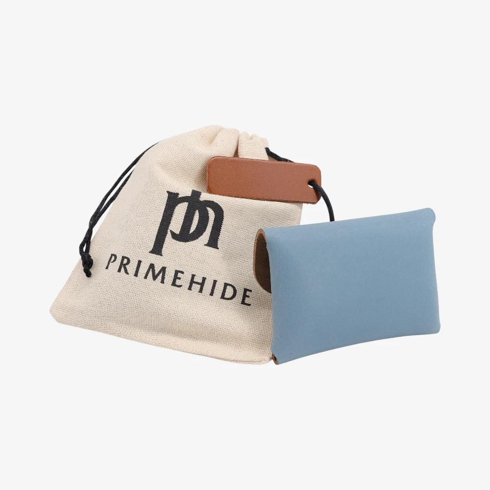 Back view of powder blue leather coin purse with textured finish and branded pouch