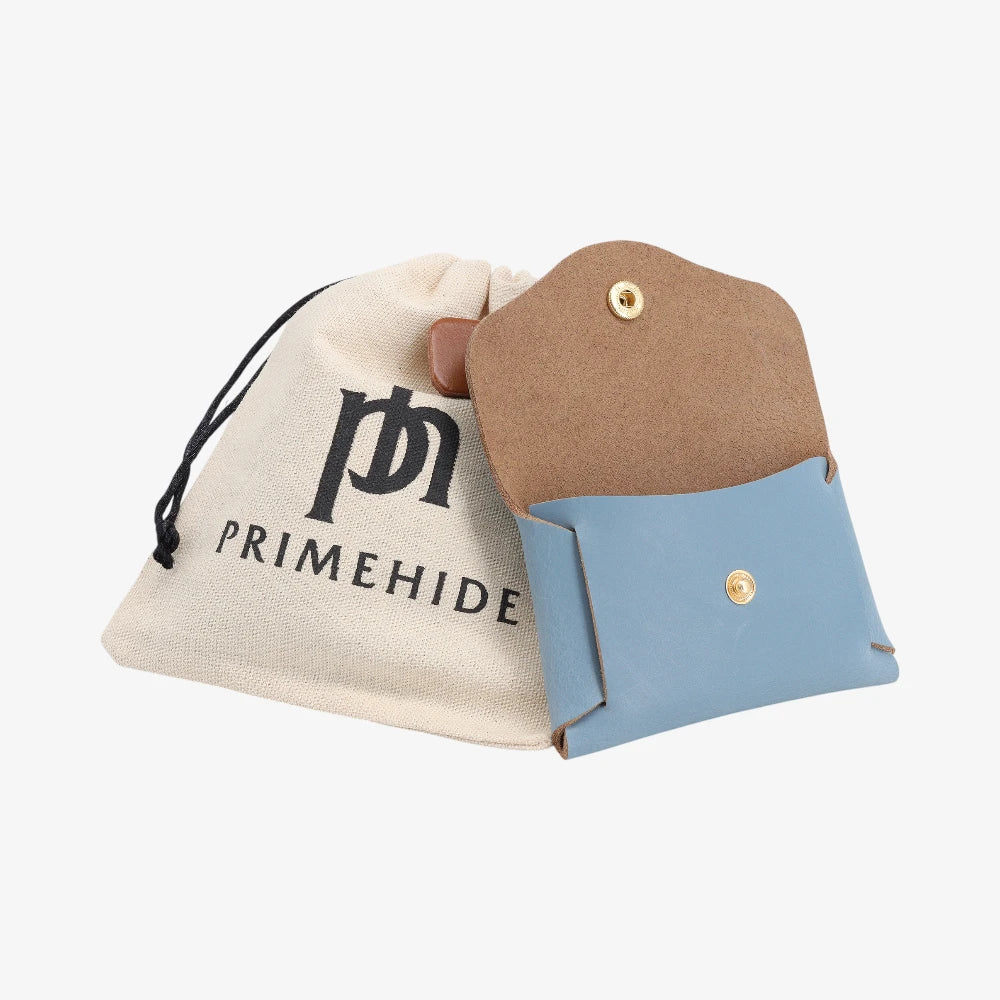 Powder blue leather coin purse open view with Primehide branded drawstring pouch