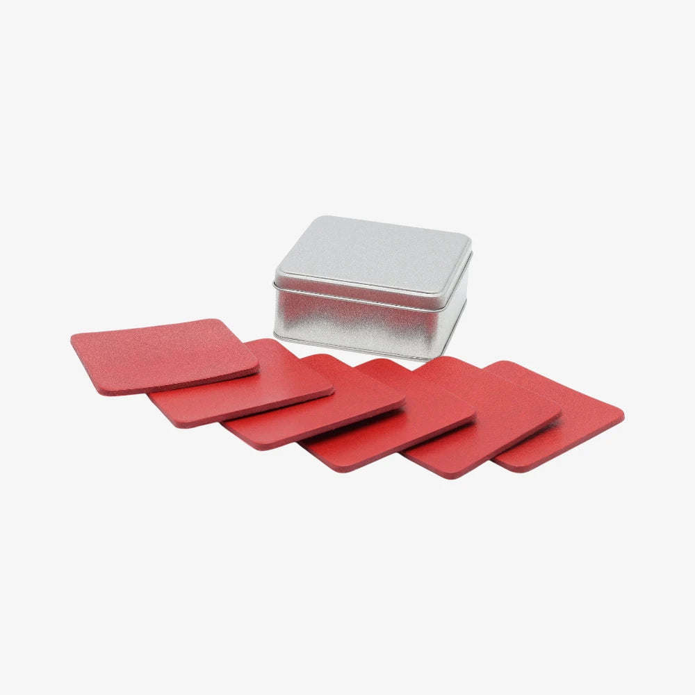 Set of  Red leather coaster set for dining room with a silver storage box on a white background