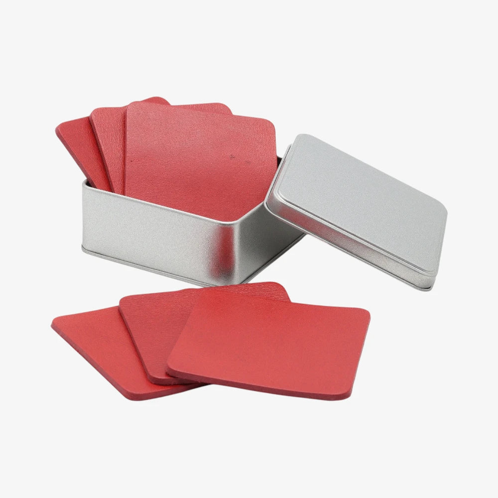 Red Leather coaster set for whisky glasses with a silver holder on a white background